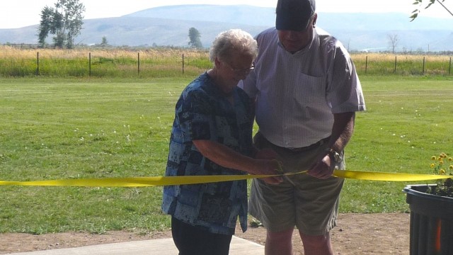 Lois Stocking and Congressman Mike Simpson cut the ribbon to the pavilion.